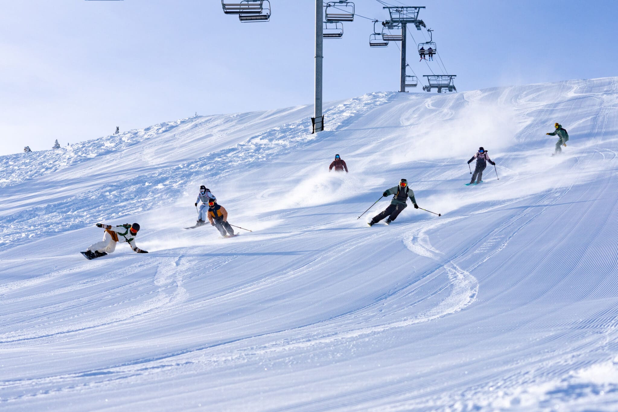 ski lesson | skiers carving on a ski piste